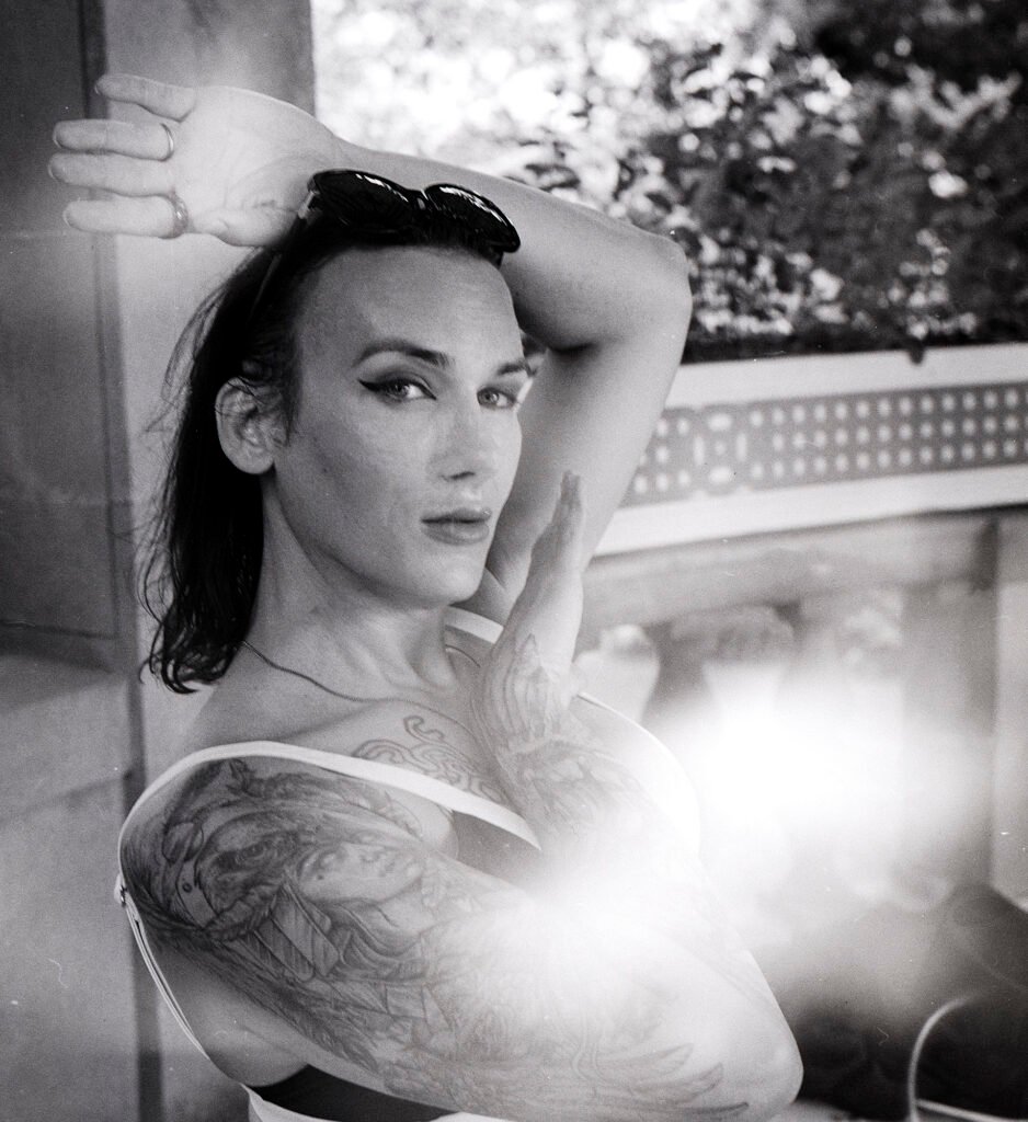 Artsy medium format black and white portrait on kodak trix film in 120 format woman with tattoo at beach